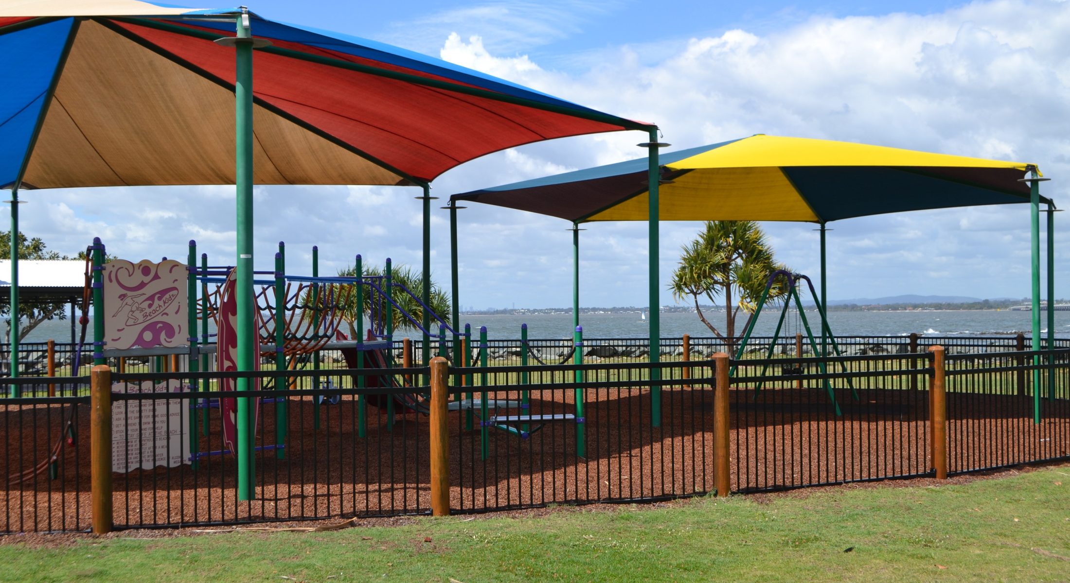 Playground at Pelican Park is fenced and has a Liberty Swing